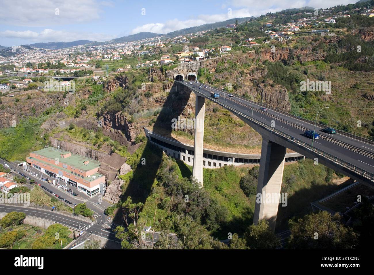 view from botanical gardens of elevated VR1 road and Northern Funchal Madeira Stock Photo