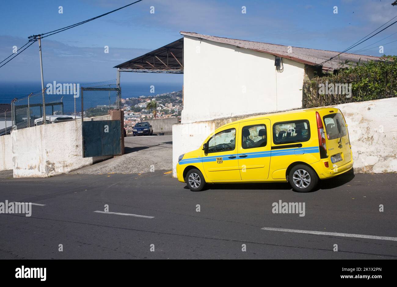 yellow Renault Kangoo taxi on Estrada da Boa Nova in Northern Funchal, Madeira Stock Photo