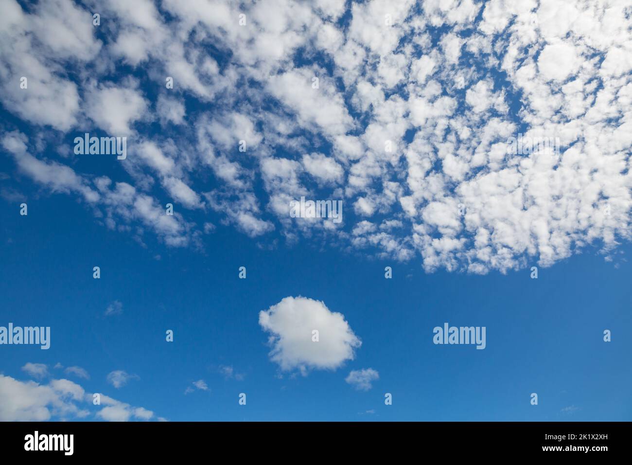 Sunny background, blue sky with white clouds, natural background. Stock Photo