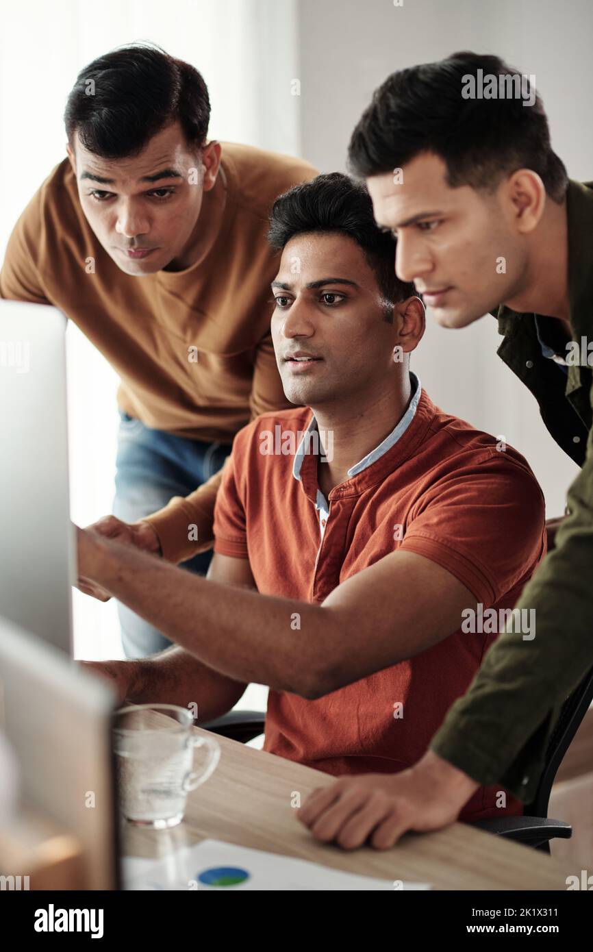 Team of Indian software engineers establishing specifications of ...