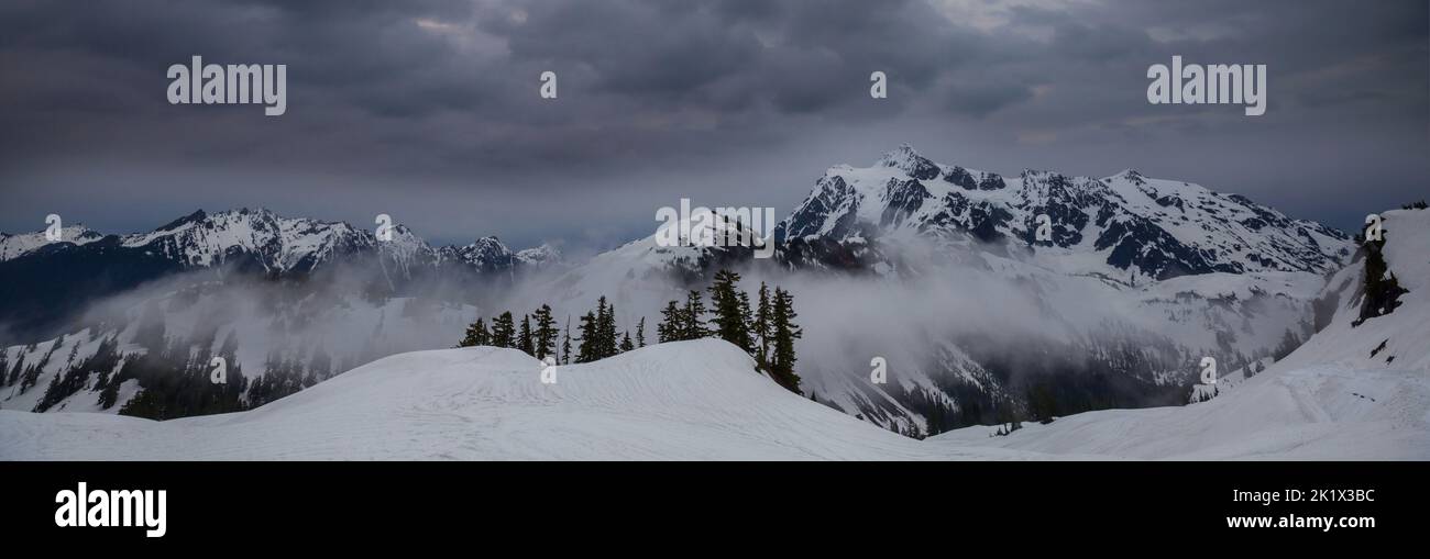 Snow covered mountains in winter season Stock Photo