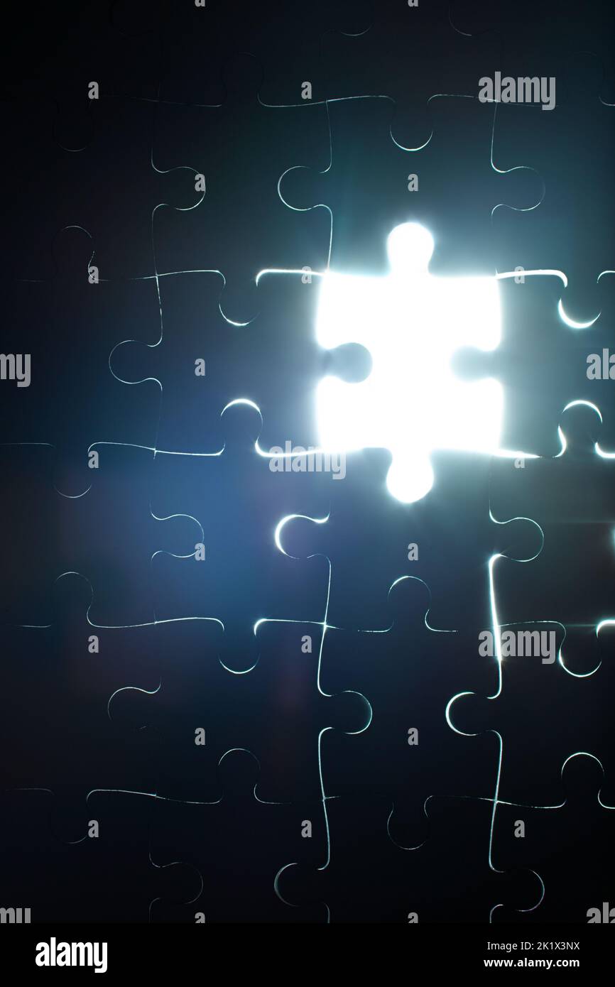 The final piece of the puzzle. a puzzle missing a single piece Stock