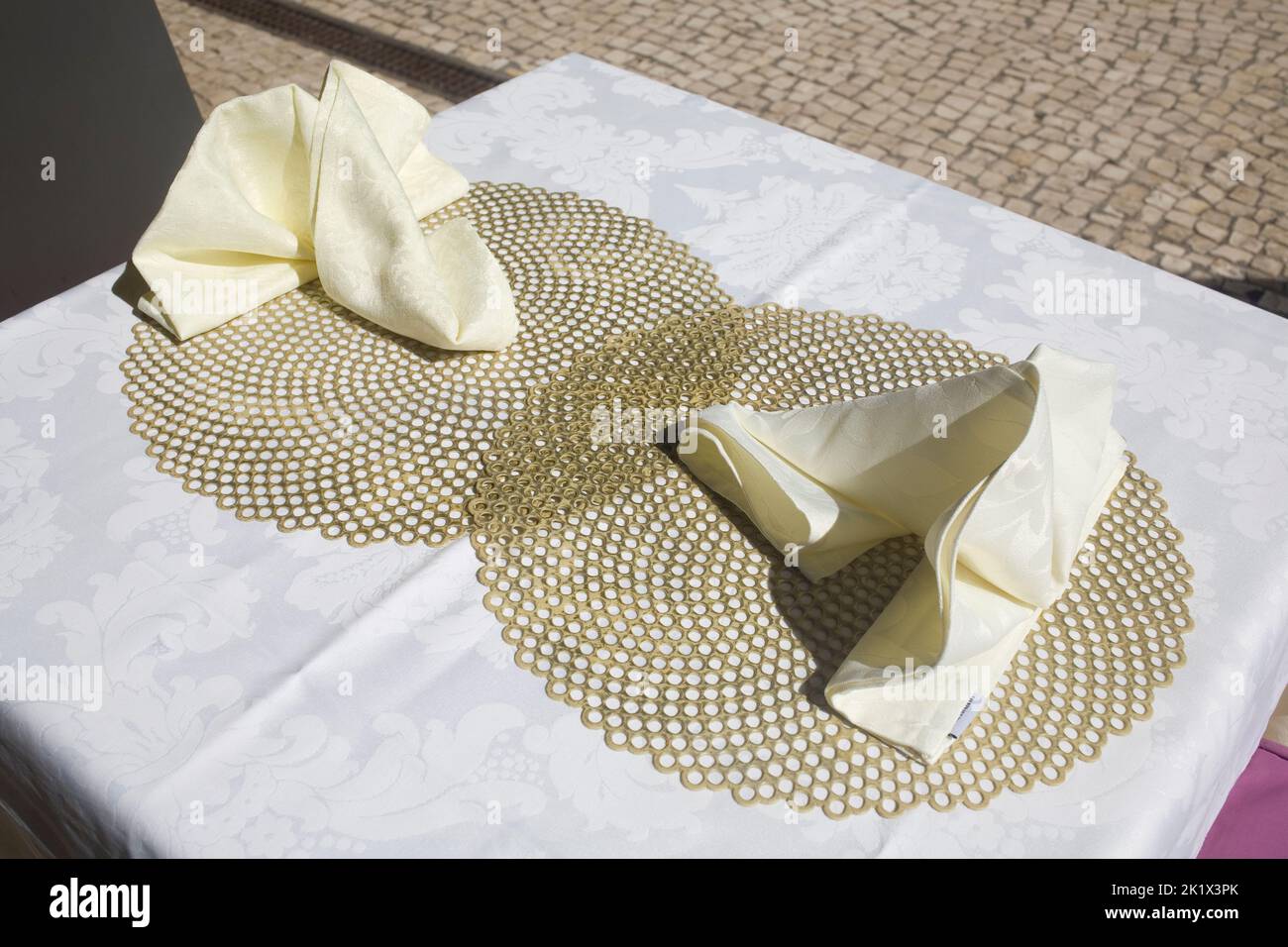 table ready with tablecloth, doilies and napkins on Rua da Carreira in Funchal Madeira Stock Photo