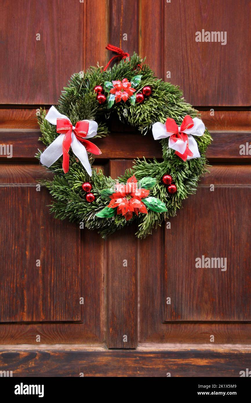 Christmas wreath on the wood red door Stock Photo