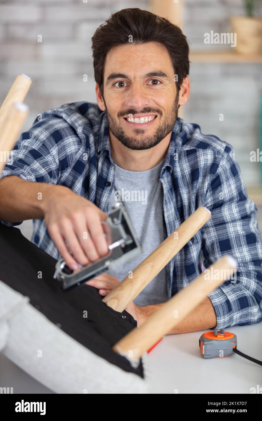 Man repairing chair hires stock photography and images Alamy