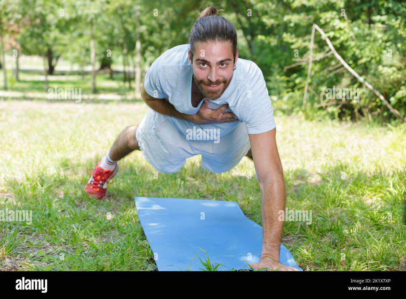 sporty man doing push-up in an outdoor gym Stock Photo - Alamy