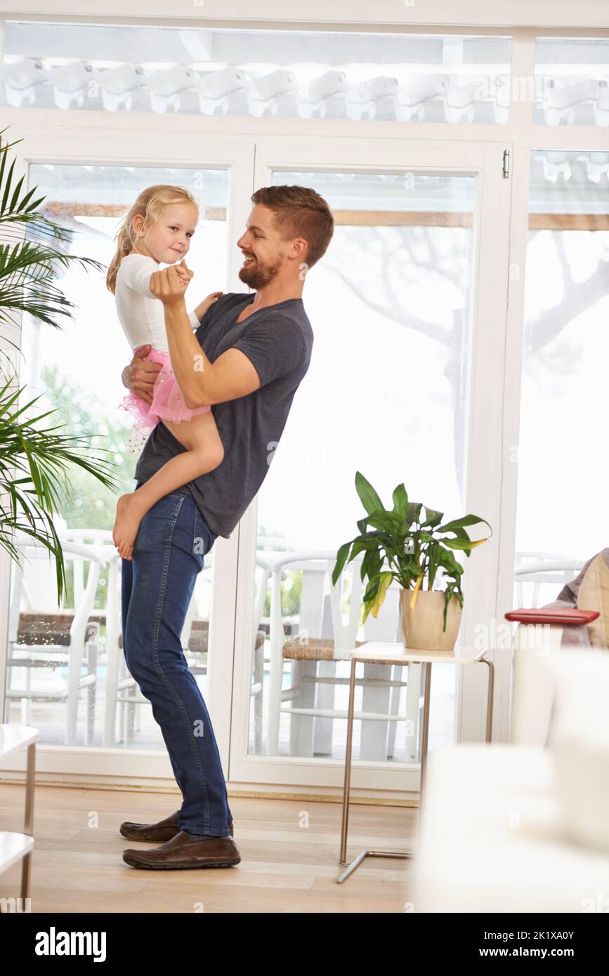 Having a fun moment dancing with dad. Full length shot of a father and daughter dancing. Stock Photo