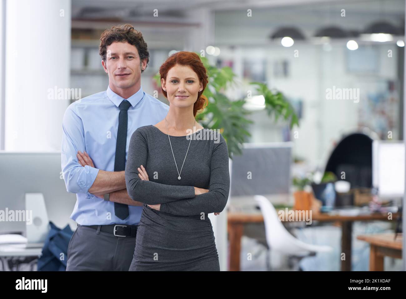 Woman standing behind desktop hi-res stock photography and images - Alamy