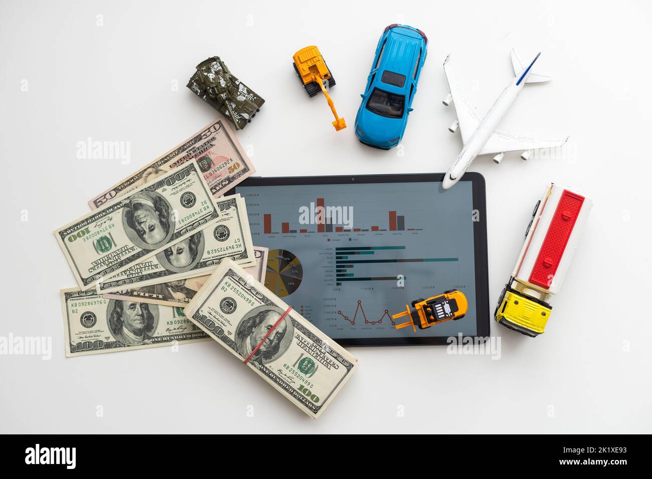 Tablet computer with different types of toy transport Stock Photo