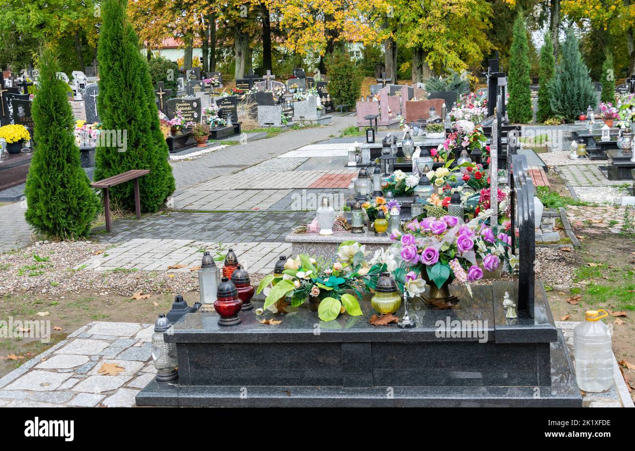 Mazowieckie, Poland October 10, 2019 Flowers on graves. Cemetery before All Saints' Day