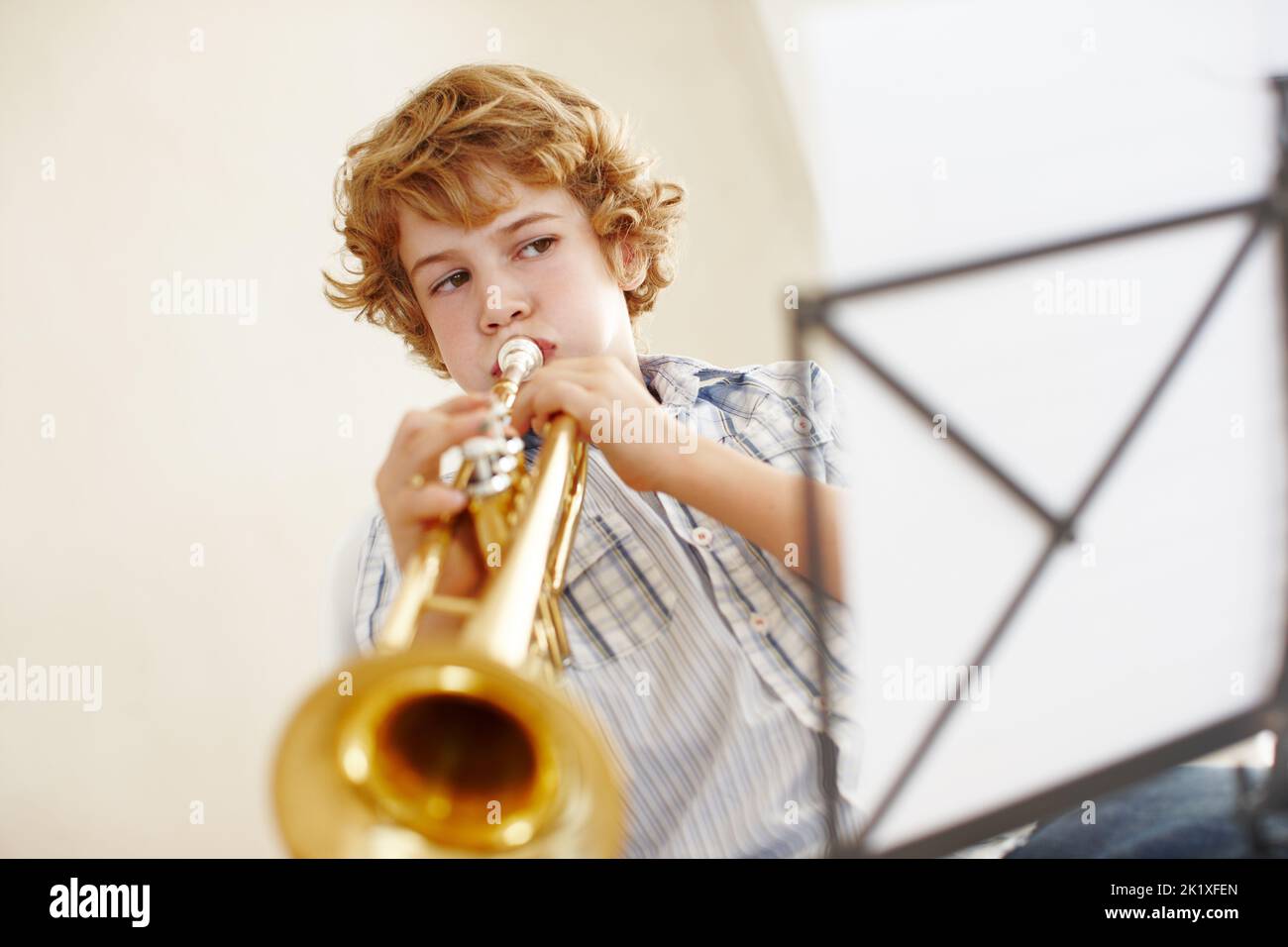 Talented boy playing the trumpet hi-res stock photography and images - Alamy