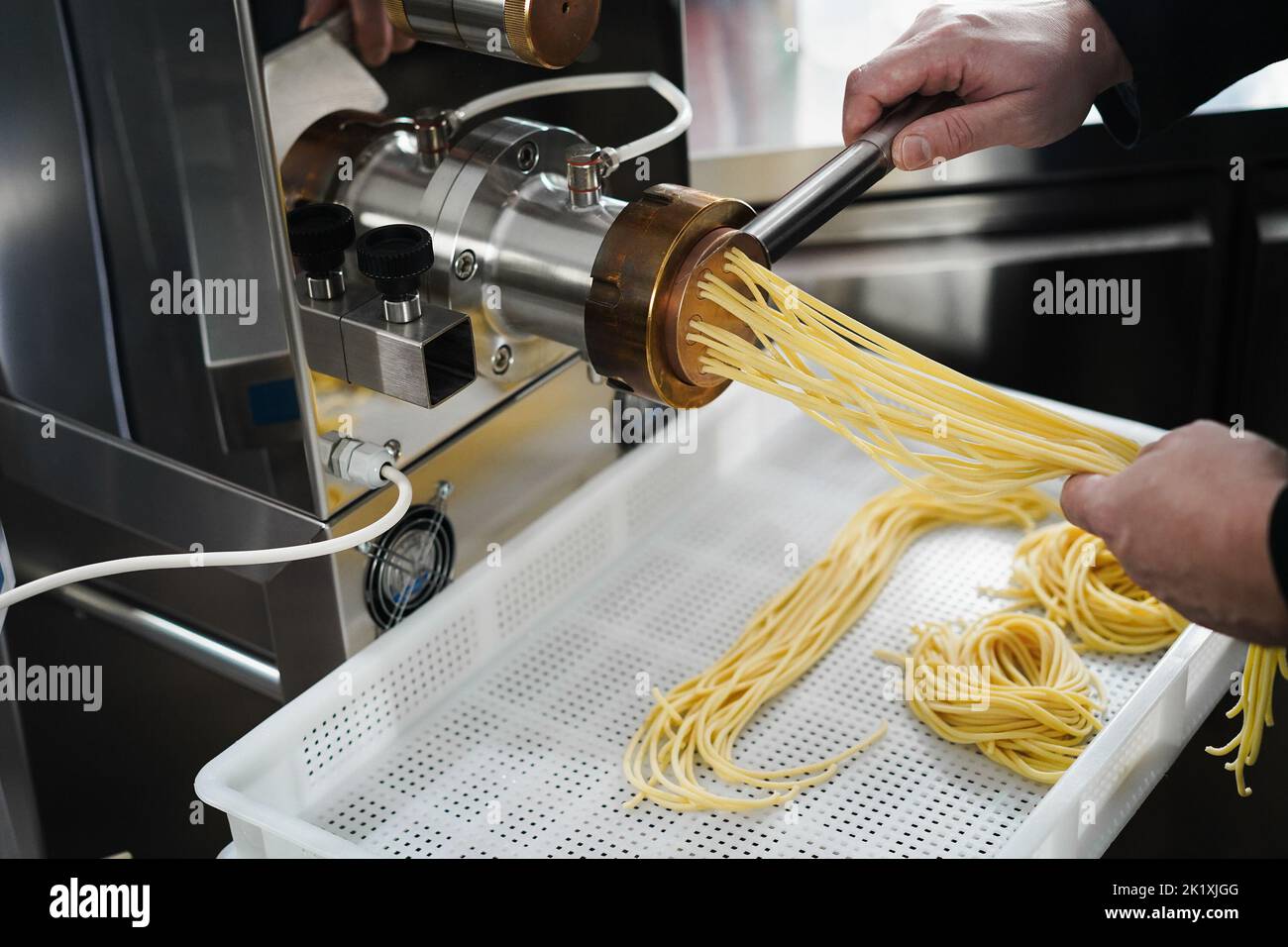 https://c8.alamy.com/comp/2K1XJGG/chef-working-with-pasta-manufacture-machine-2K1XJGG.jpg