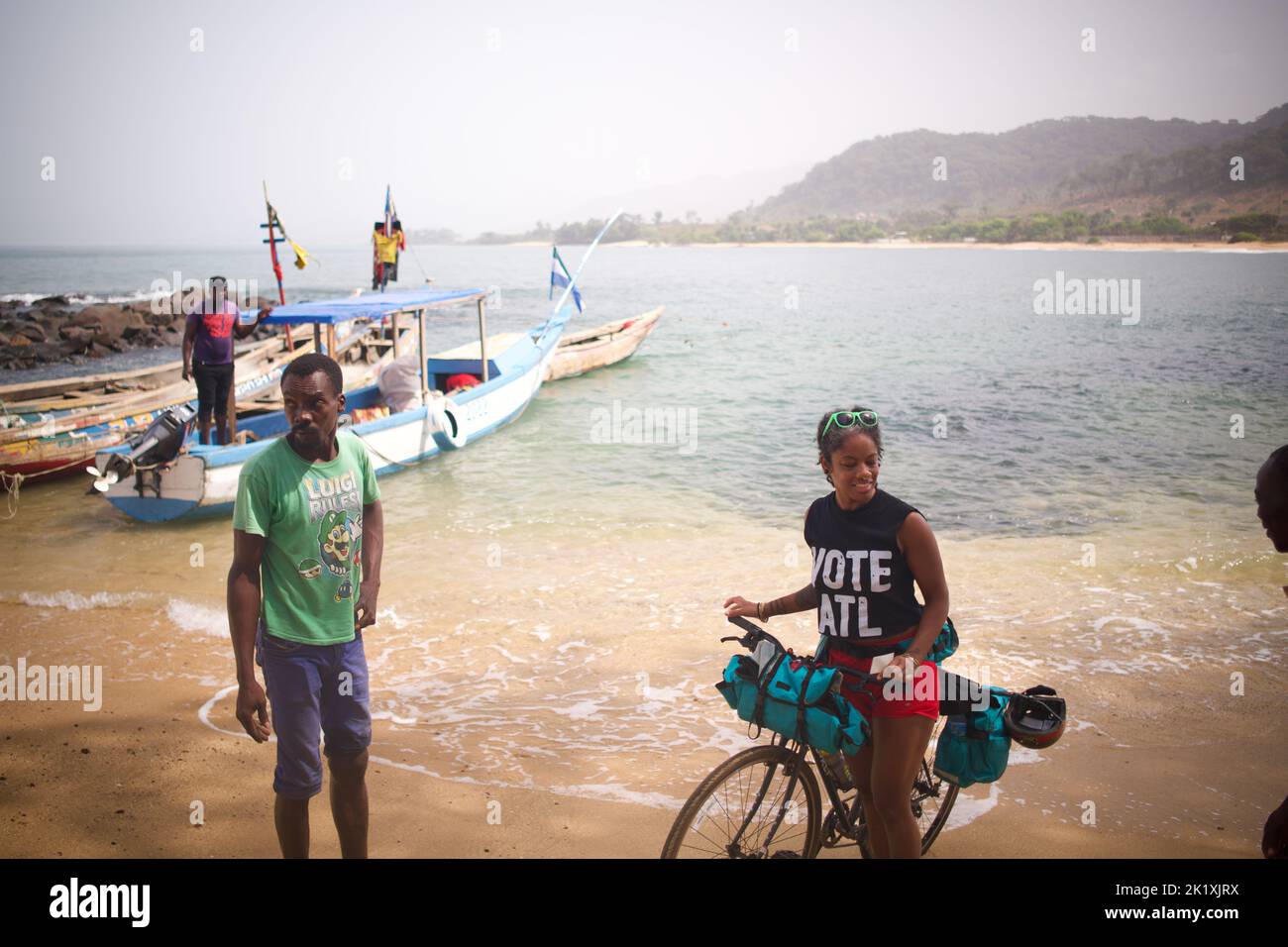A bunch of tourists enjoying and cycling on the beach in Freetown, Sierra Leone Stock Photo