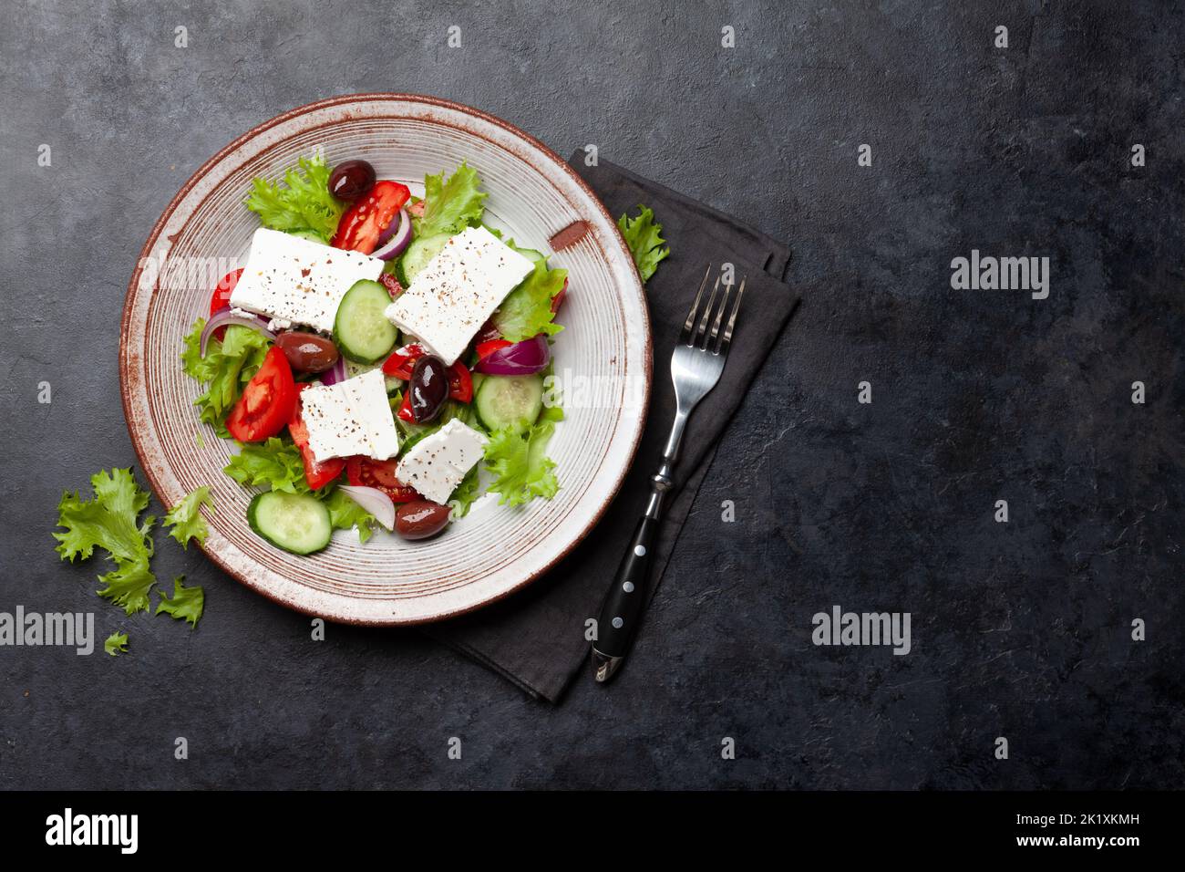 Greek salad with fresh vegetables and feta cheese. Flat lay with copy space Stock Photo