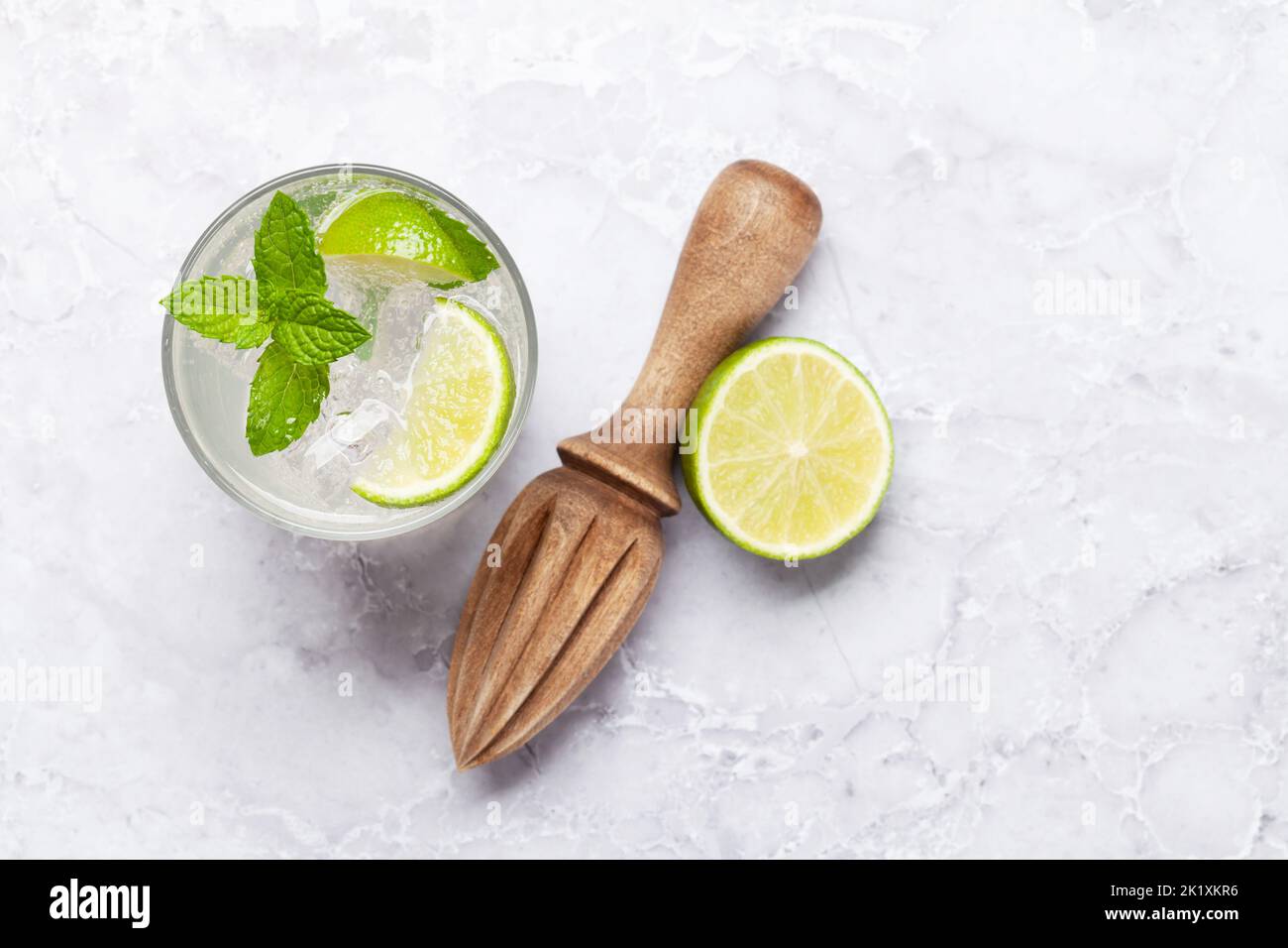Mojito cocktail ingredients and drinks utensils. On stone table flat lay with copy space Stock Photo