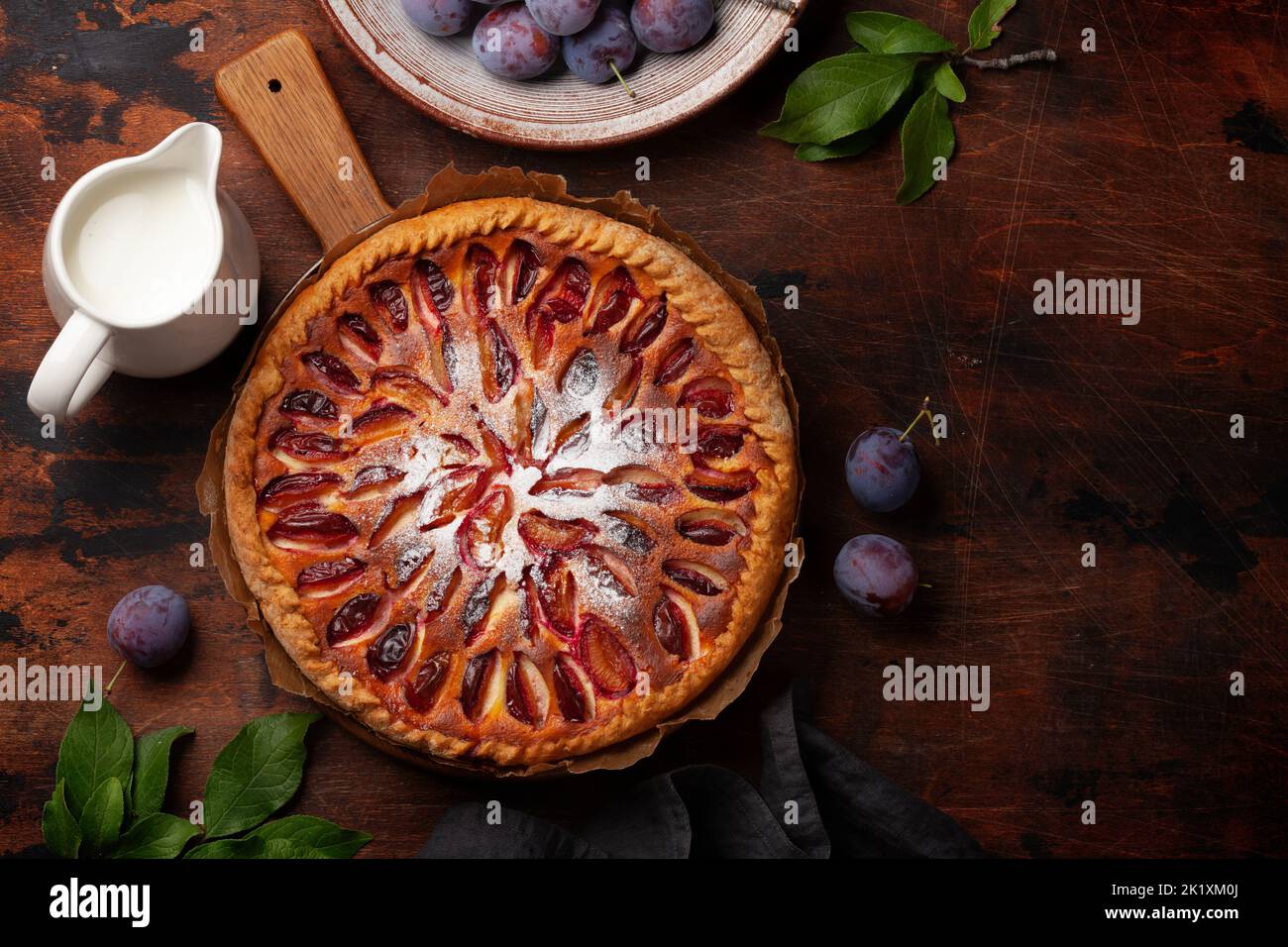 Homemade plum pie. Fruit tart with seasonal fruits. Flat lay with copy space Stock Photo