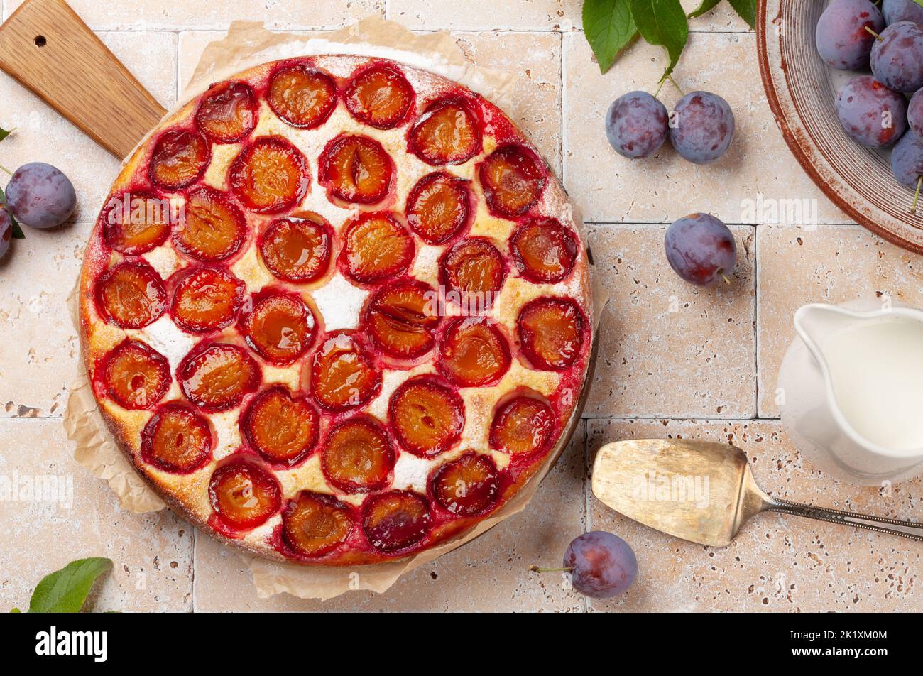 Homemade plum pie. Fruit tart with seasonal fruits. Flat lay Stock Photo