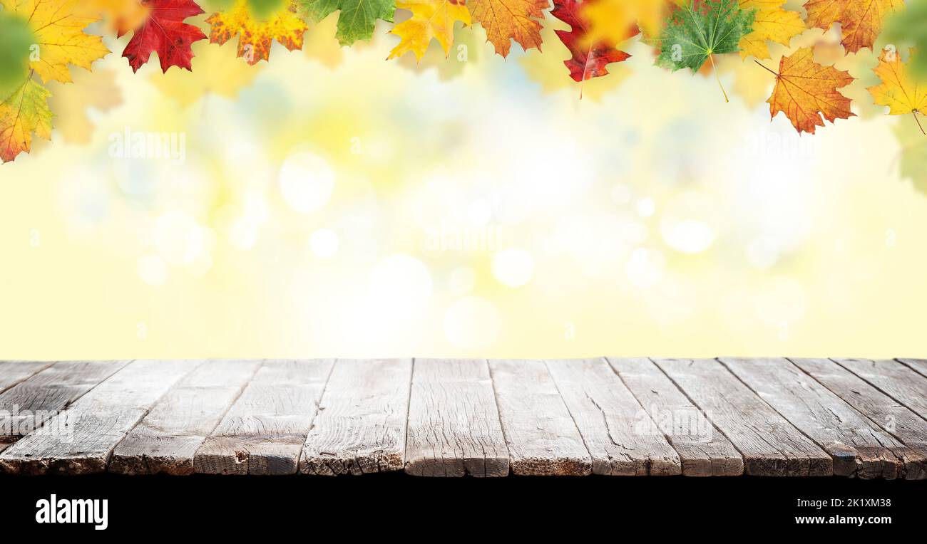 Wooden table and autumn bokeh background for your product Stock Photo ...