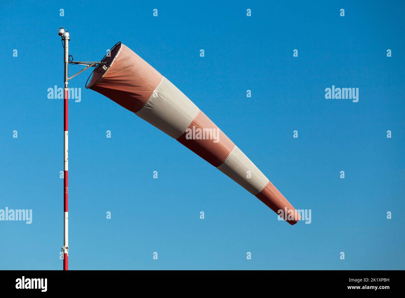 Close-up of an airfield windsock in moderate winds. Stock Photo
