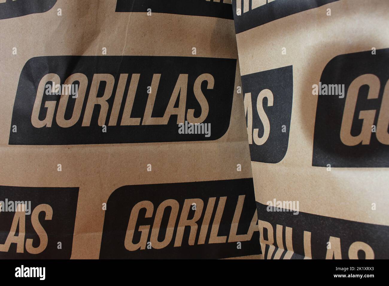 London, UK - September 12, 2022: Paper bags from the on-demand grocery delivery company Gorillas which claims to deliver groceries in 10 minutes Stock Photo