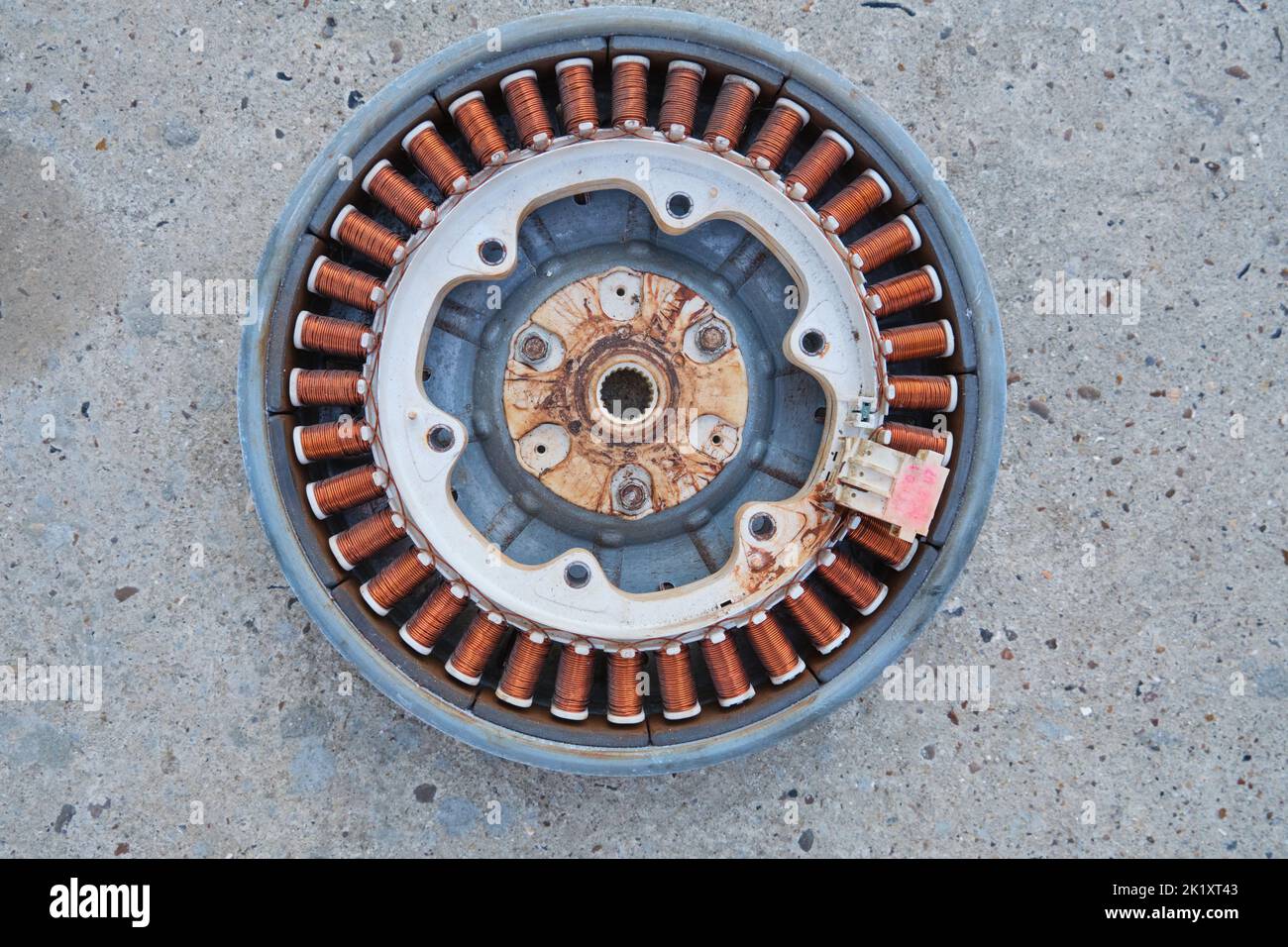 Details disassembled electric motor washing machine close up isolated