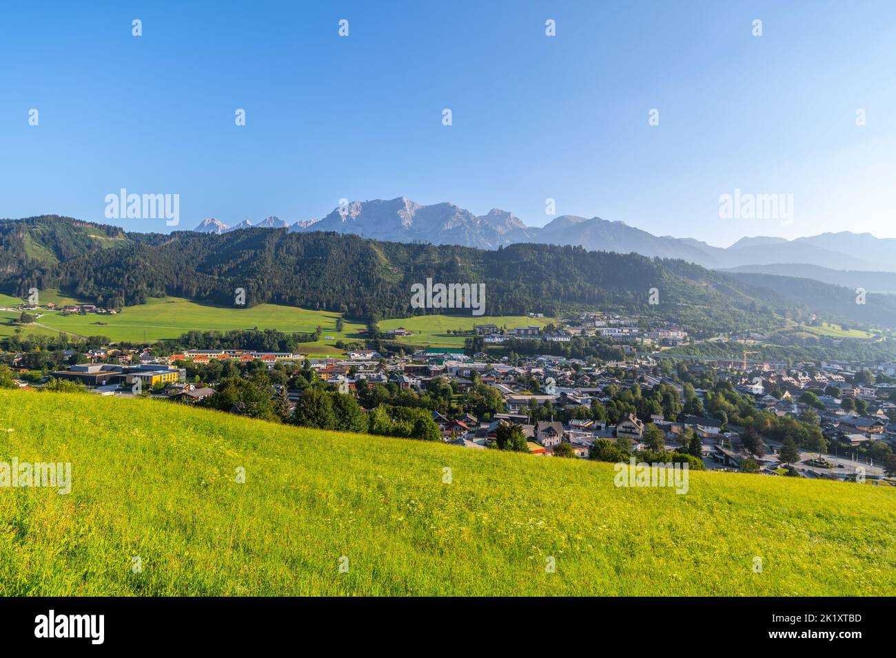 Panoramic view of Schladming and Dachstein Mountain Group on background at sunrise time. Rocky ridge with Hoher Dachstein, 2995 m. Northern Limestone Stock Photo