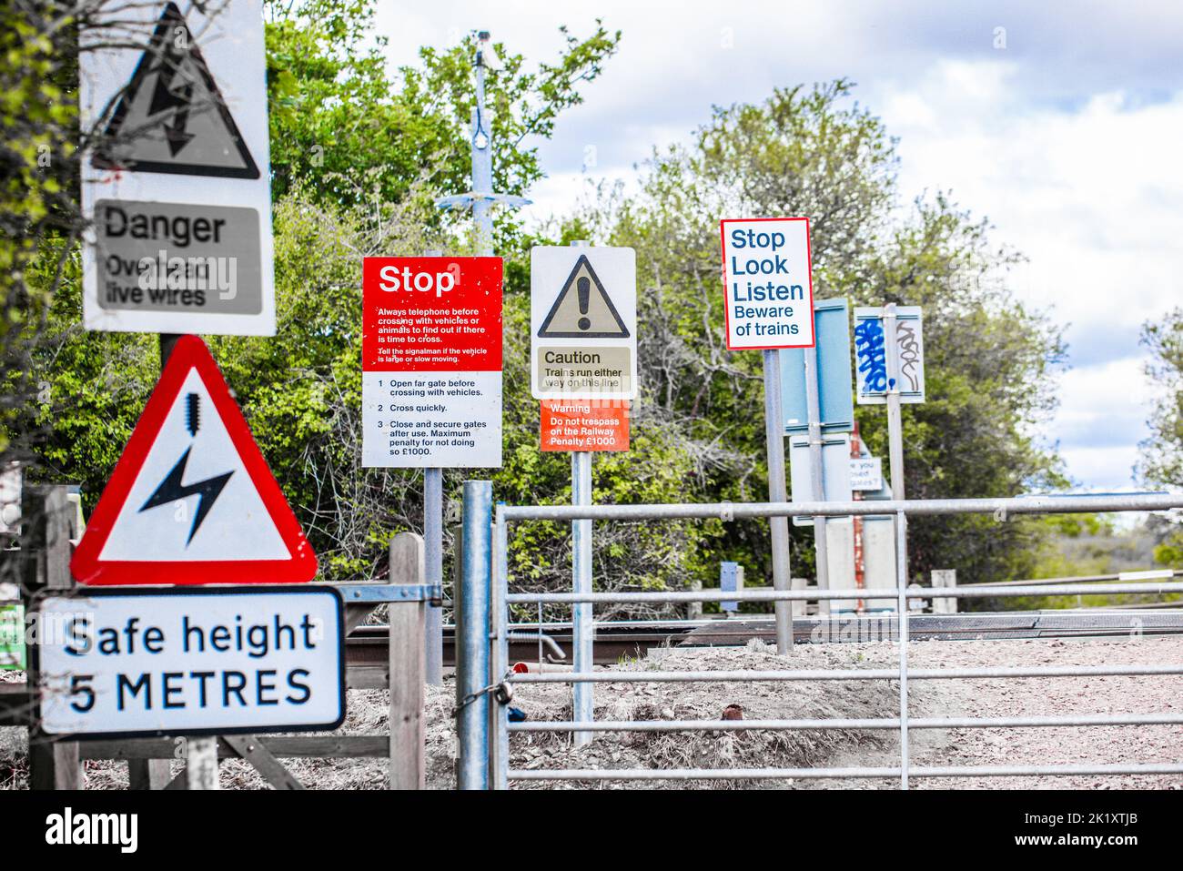 Hazard Warning signs at an unmanned Level crossing, Greater Anglia Railway Line, South Woodham Ferrers, Essex, Britain. Stock Photo