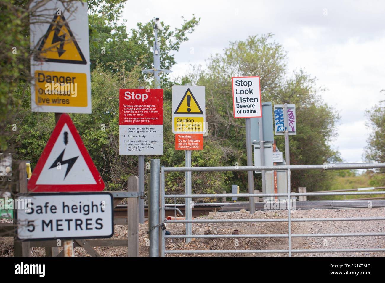 Hazard Warning signs at an unmanned Level crossing, Greater Anglia Railway Line, South Woodham Ferrers, Essex, Britain. Stock Photo