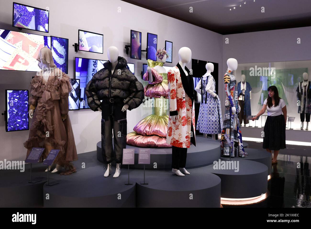 A gallery assistant looks at 'Making K-beauty and fashion' during a press view of 'Hallyu! The Korean Wave' exhibition at the V&A in London, Britain, September 21, 2022. REUTERS/Tom Nicholson Stock Photo