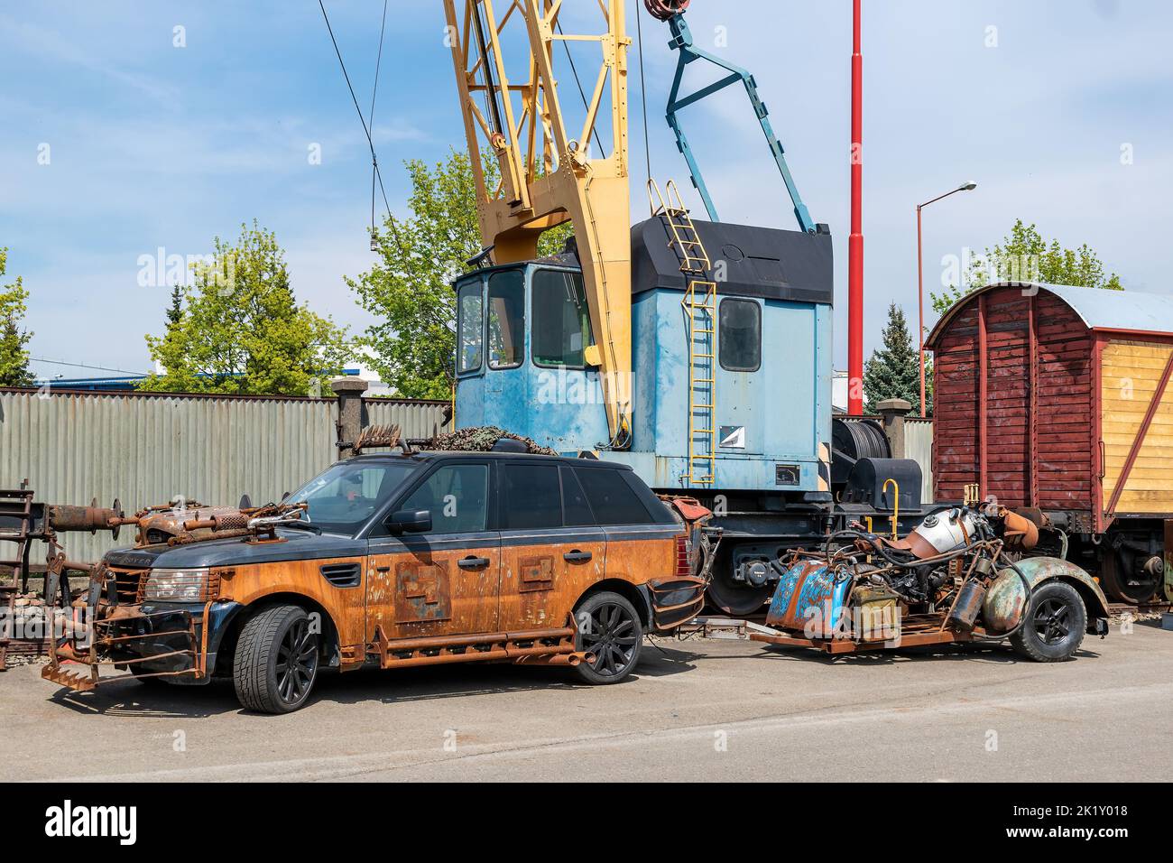 A car and trolley made of scrap metal. Art from scrap iron. Stock Photo