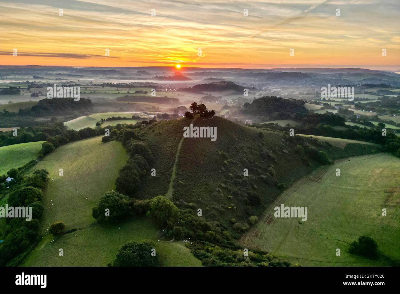 View from the air of the misty sunrise at Colmers Hill at Symondsbury near Bridport in Dorset. Picture Credit: Graham Hunt/Alamy Stock Photo