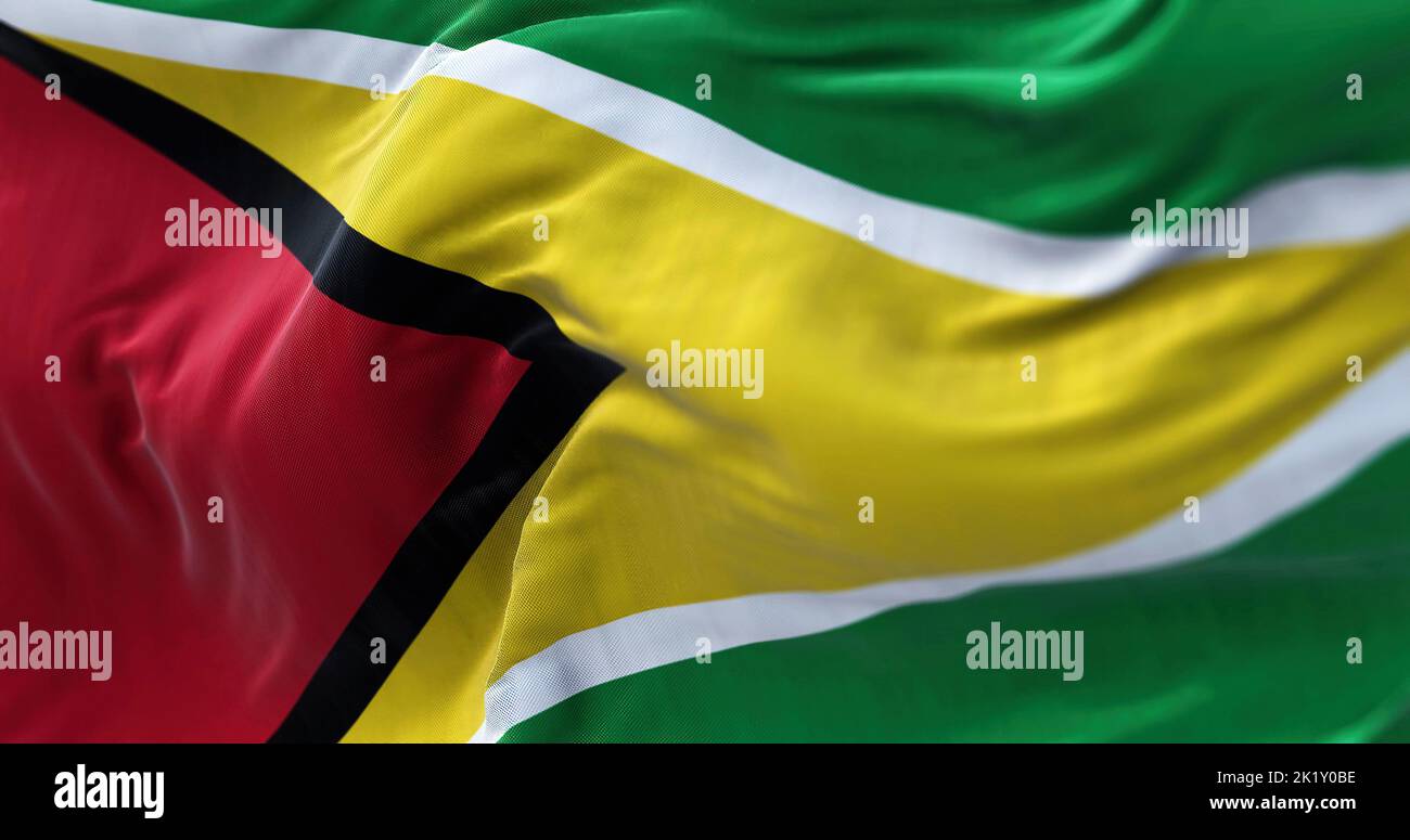 Close-up view of the Guyana national flag waving in the wind. The Co‑operative Republic of Guyana is a country on the northern mainland of South Ameri Stock Photo