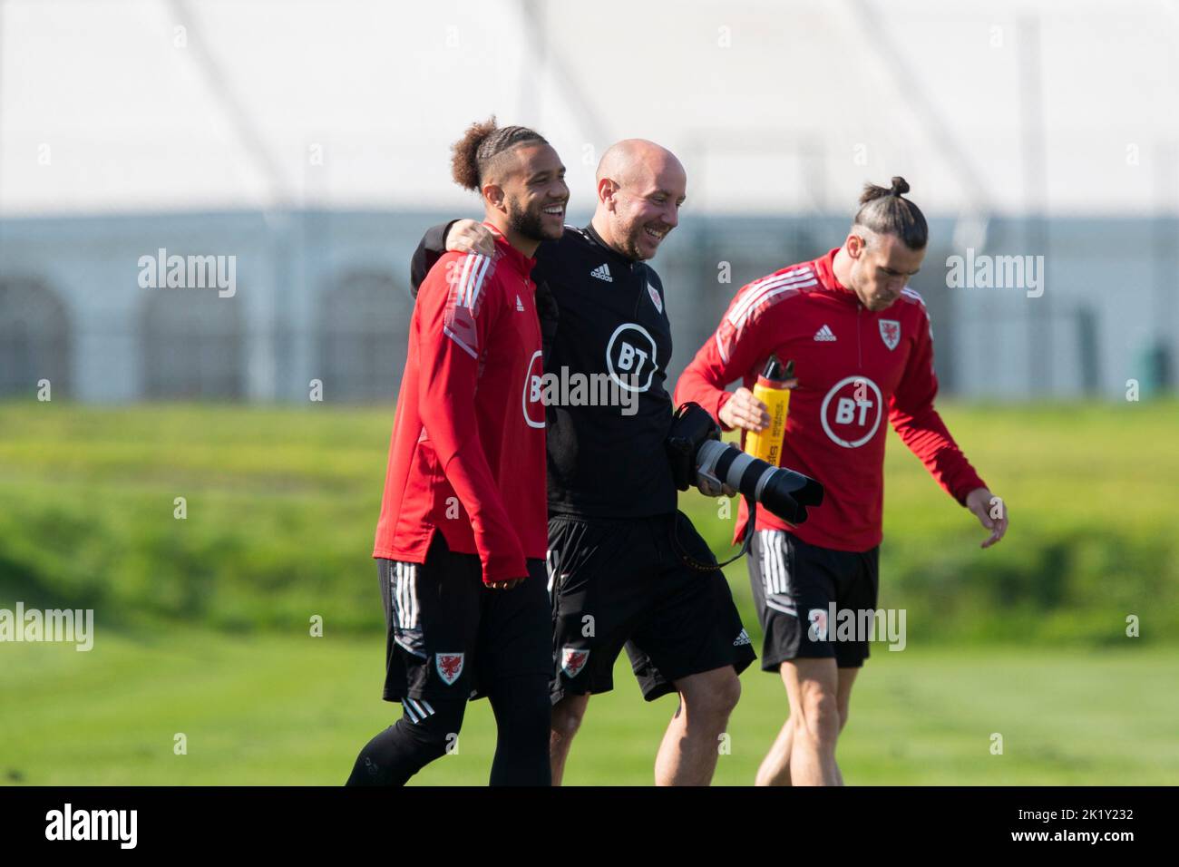 Hensol, Wales, UK. 21st Sep, 2022. Tyler Roberts enjoys a joke with team photographer John Smith during Wales national football team training at Vale Resort ahead of UEFA Nations League matches against Belgium and Poland. Credit: Mark Hawkins/Alamy Live News Stock Photo