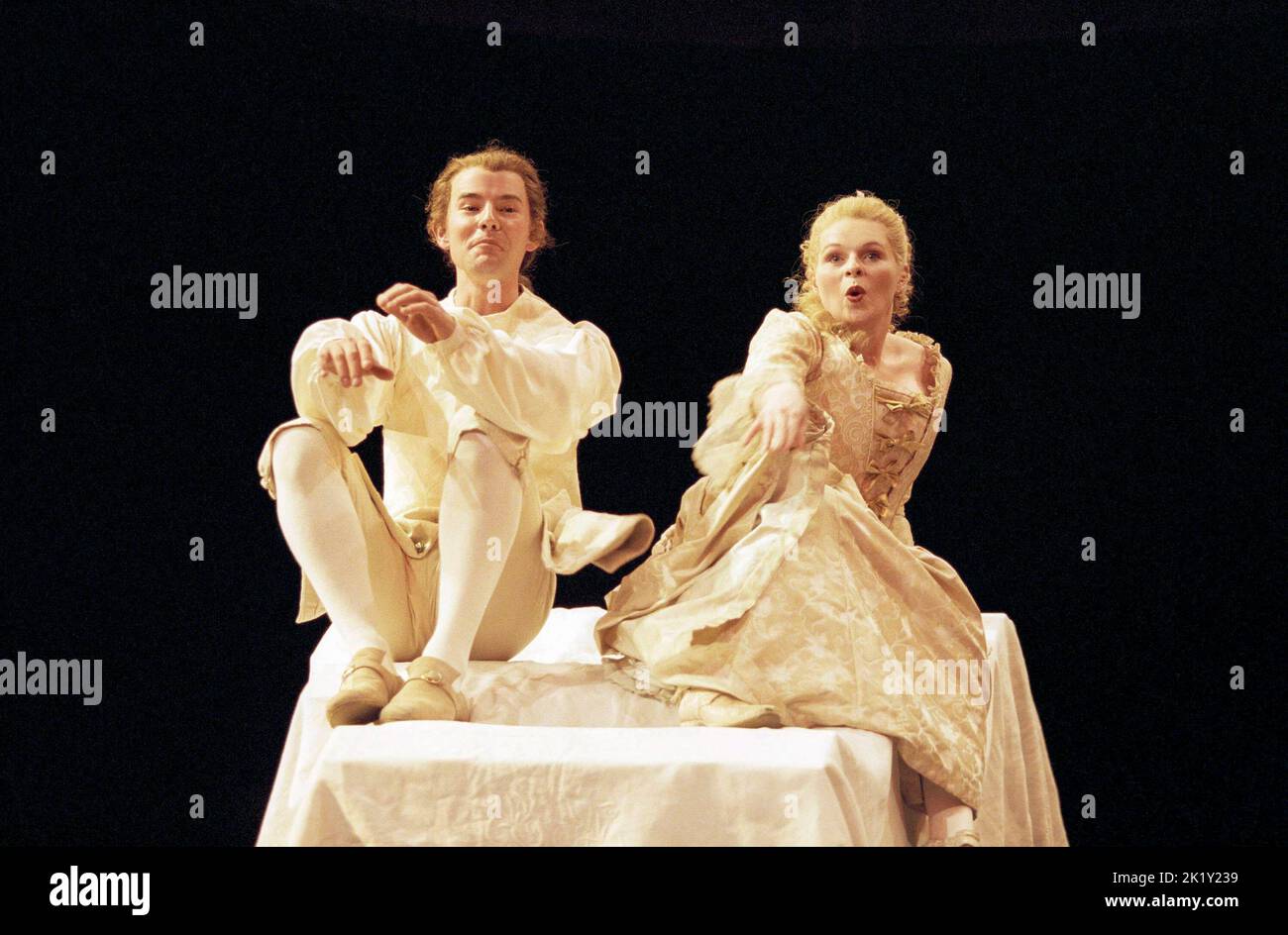Daniel Evans (Candide), Alex Kelly (Cunegonde) in CANDIDE at the Olivier Theatre, National Theatre (NT), London SE1 13/04/1999 music by Leonard Bernstein lyrics by Richard Wilbur, Stephen Sondheim, John Latouche, Lillian Hellman, Dorothy Parker & Leonard Bernstein book adapted from Voltaire by Hugh Wheeler in a new version by John Caird directed by John Caird & Trevor Nunn design: John Napier Stock Photo