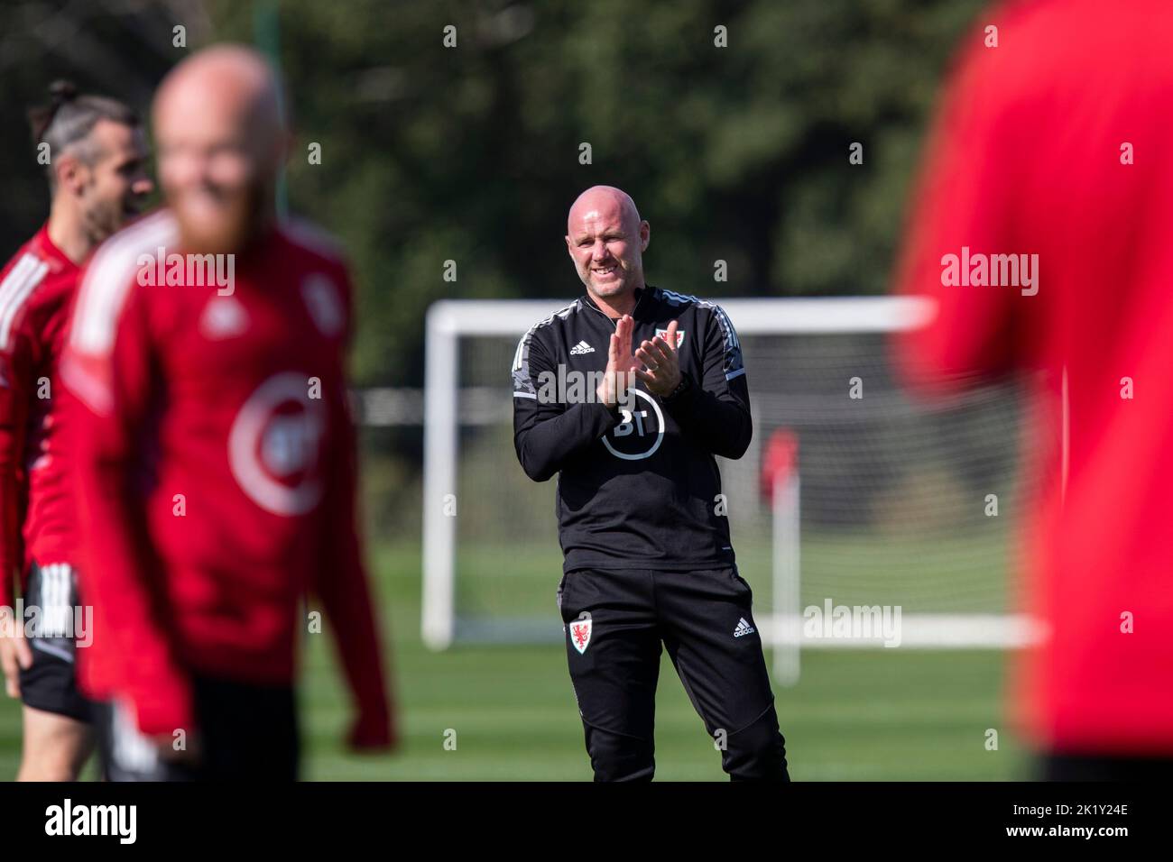 Hensol, Wales, UK. 21st Sep, 2022. Team coach Rob Page claps his players during Wales national football team training at Vale Resort ahead of UEFA Nations League matches against Belgium and Poland. Credit: Mark Hawkins/Alamy Live News Stock Photo