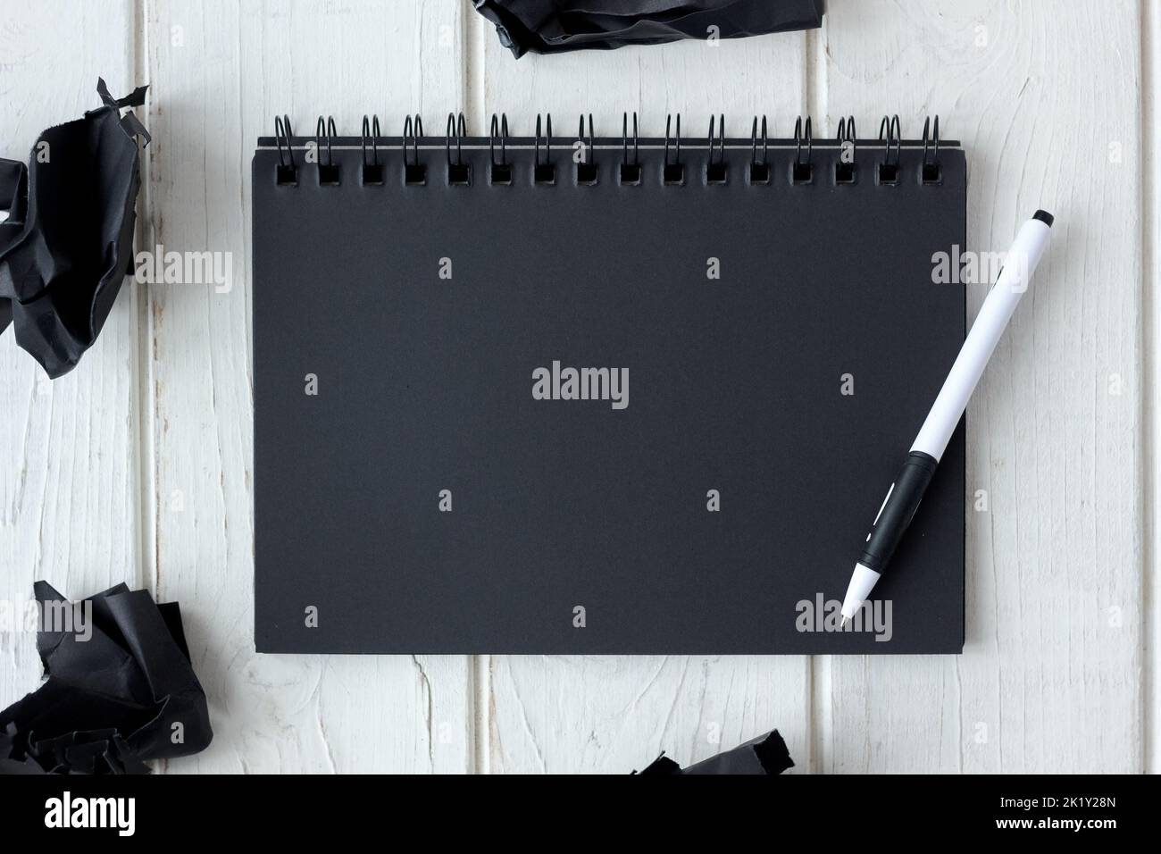 Note book with black pages with a pen Stock Photo Alamy