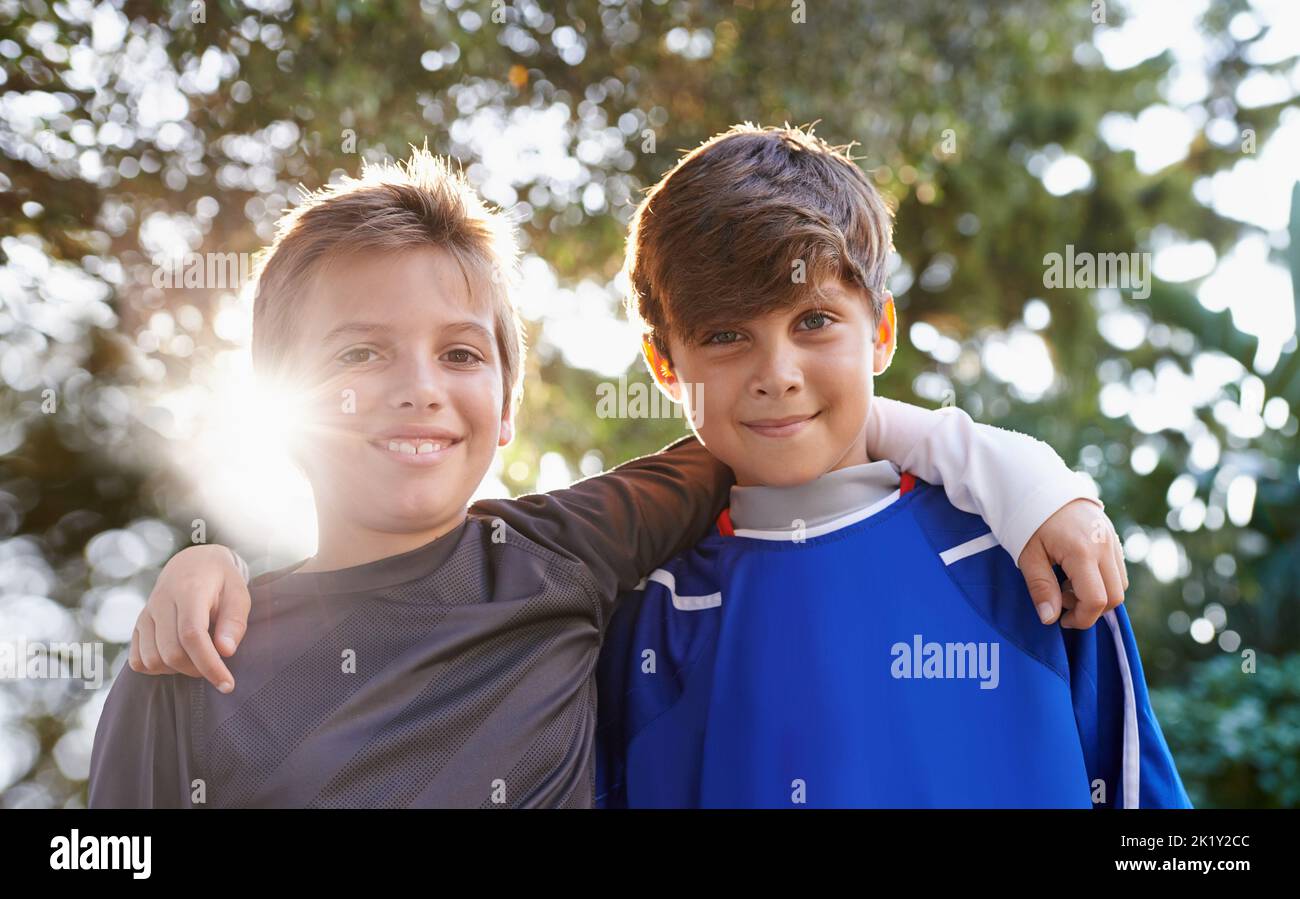 Brothers and friends. Cropped portrait of two young brothers standing ...