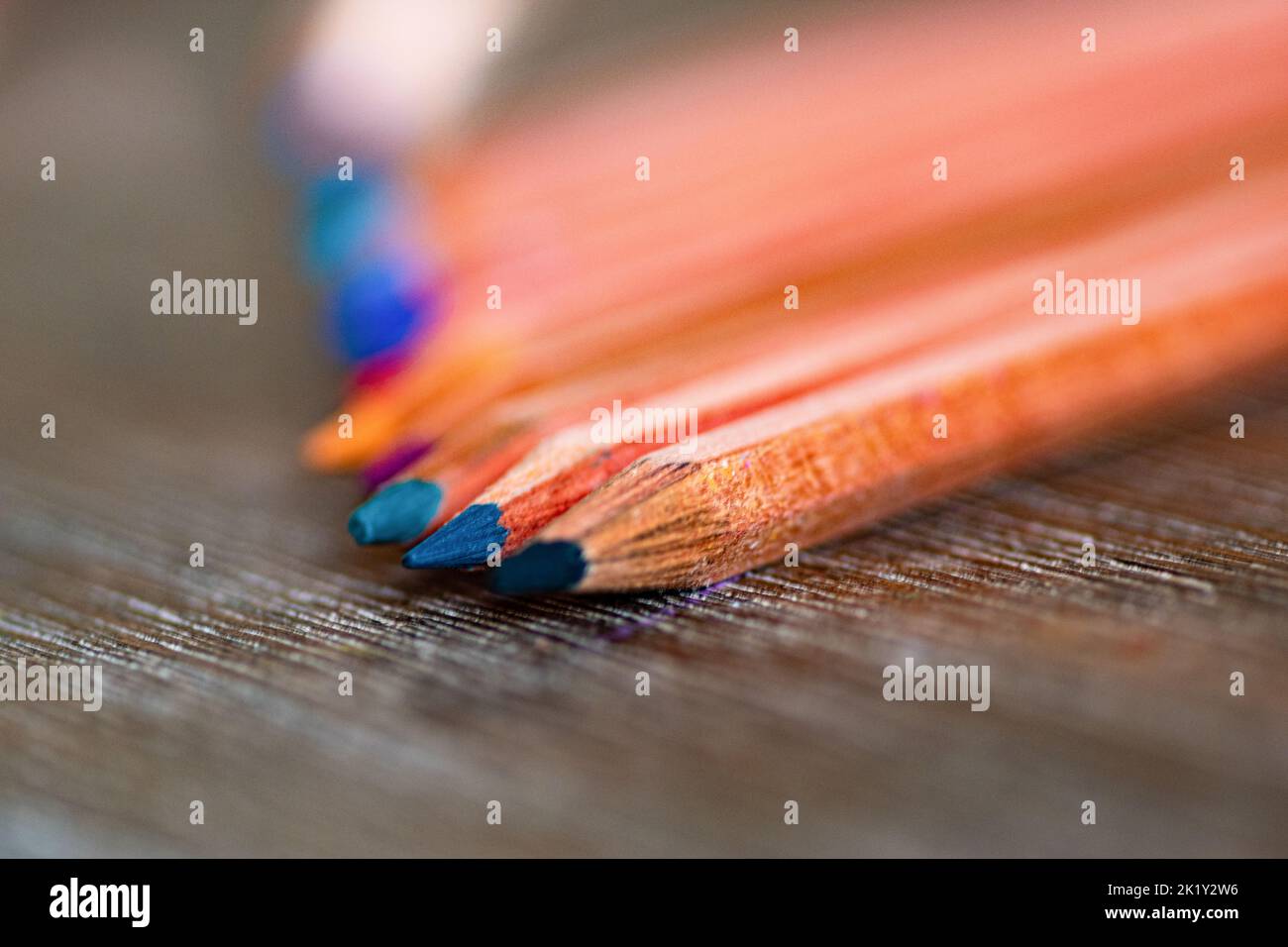 Selective focus. Several colored pencils placed on the table. Stock Photo