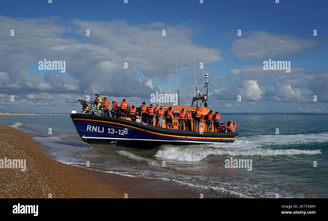A group of people thought to be migrants are brought in to Dungeness, Kent, by the RNLI following a small boat incident in the Channel. Picture date: Wednesday September 21, 2022. Stock Photo