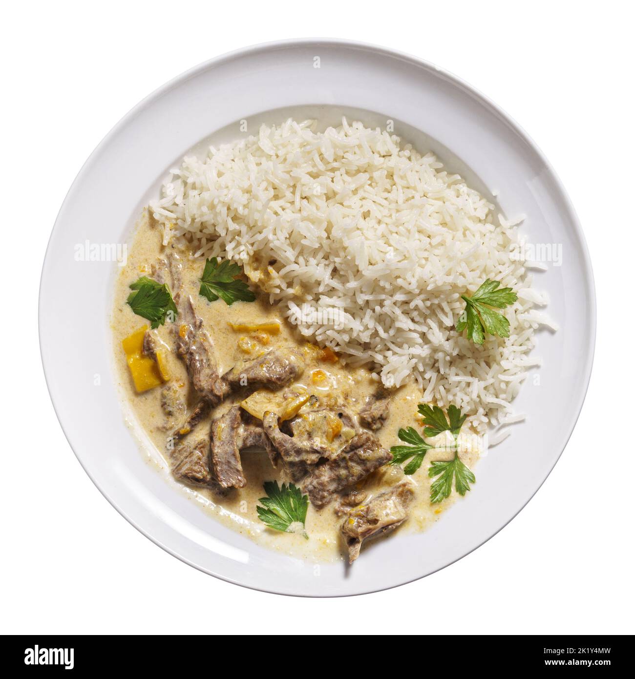 Beef Stroganoff with rice on plate isolated on white, top view Stock Photo