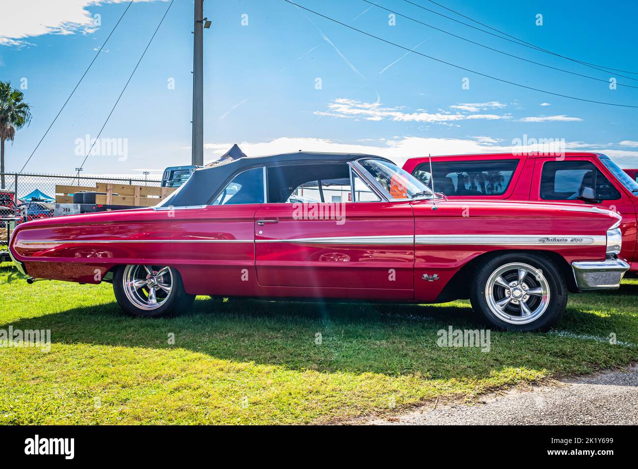 Daytona Beach, FL - November 28, 2020: Low perspective side view of a 1964 Ford Galaxie 500 Convertible at a local car show. Stock Photo