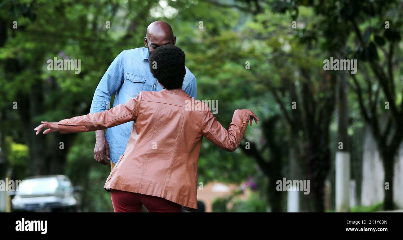 Happy carefree black couple dancing together outside in street Stock ...