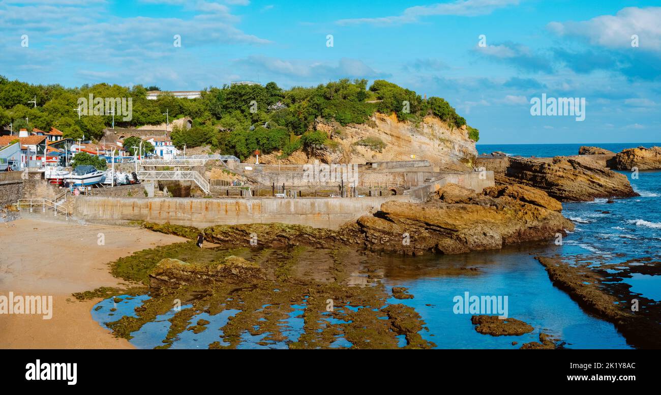 Biarritz, France - June 24, 2022: A view of the Plage du Port des Pecheurs Beach in Biarritz, France, and the Port des Pecheurs, the fishermen port, i Stock Photo
