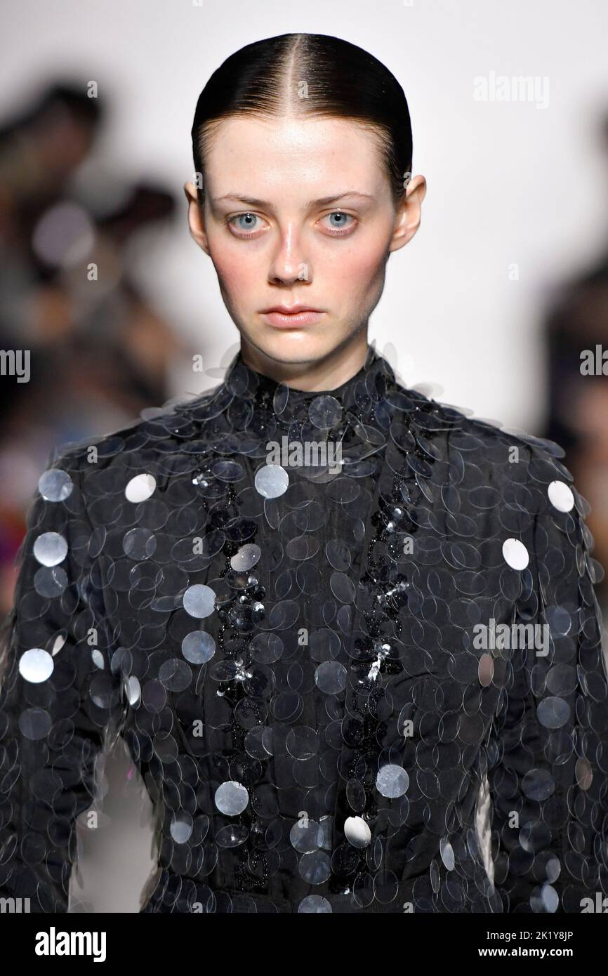 A model walks on the runway at the IA London fashion show during