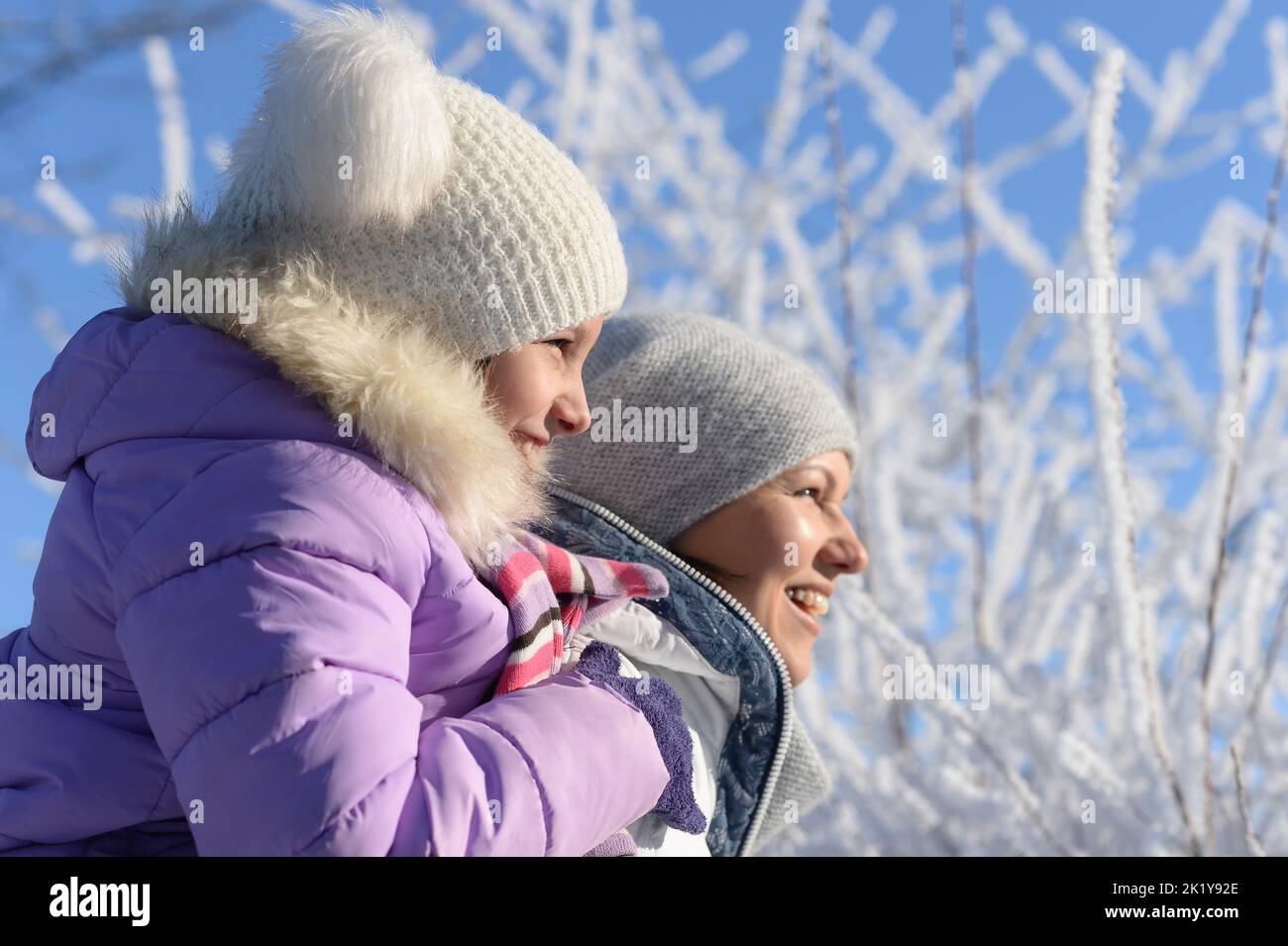 Beautiful mother and daughter enjoy winter together Stock Photo