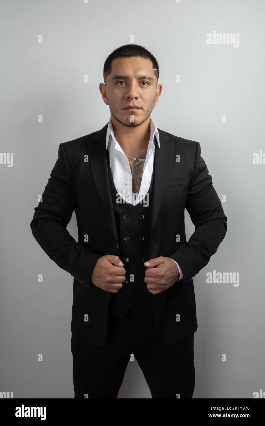 portrait of latin young man with short hair wear suit with formal shirt