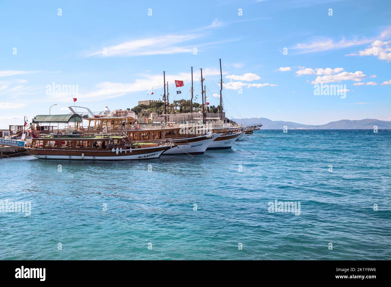 KUSADASI, TURKEY - JUNE 2, 2021: This is the pier for pleasure boats at the Guverginada fortress. Stock Photo