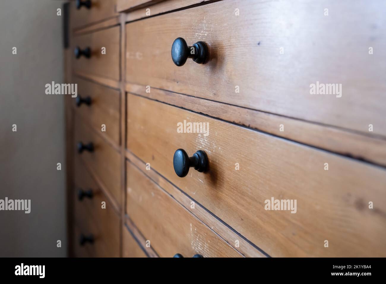 Close-up of an old wooden chest with drawers, for storage. Stock Photo