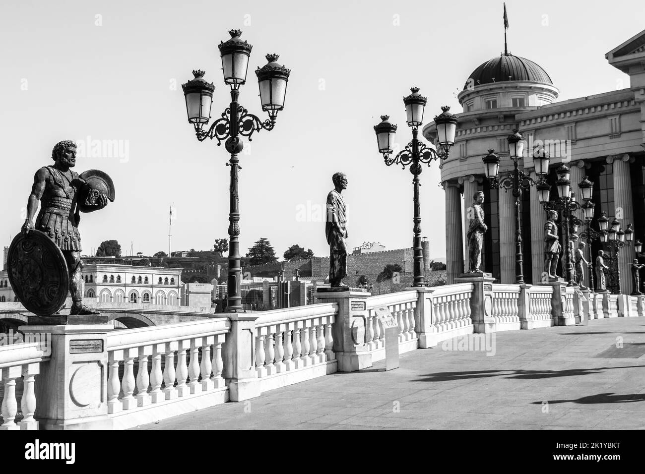 Statues decorating the Bridge of Civilisations, in front of Archaeology Museum, Skopje, North Macedonia. Bridge crossing the Vardar River, in summer. Stock Photo