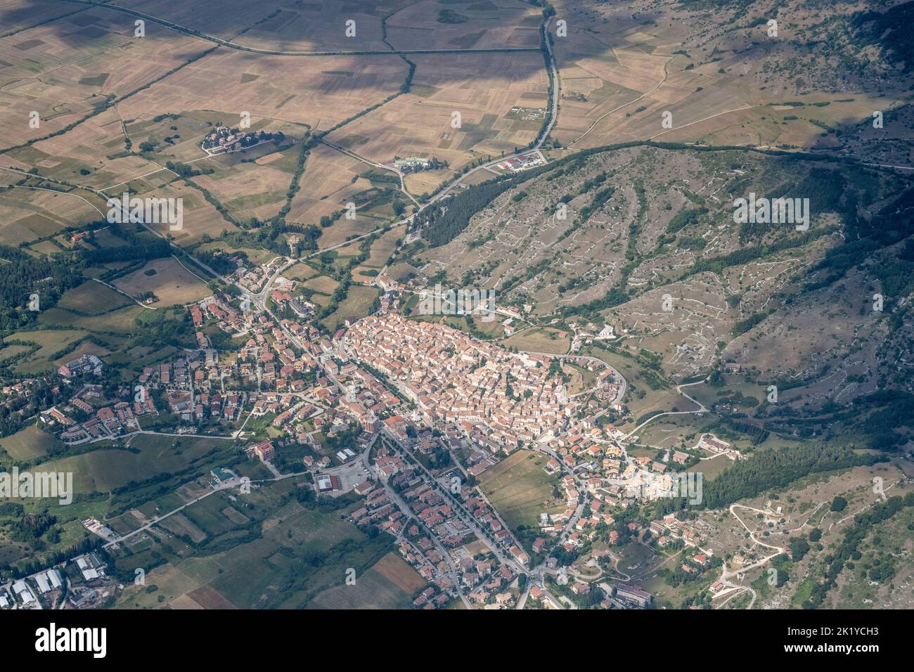 aerial shot, from a small plane, of Rocca di Mezzo village in Ovindoli upland, shot in bright summer light from south-west, Apennines, L'Aquila, Abruz Stock Photo